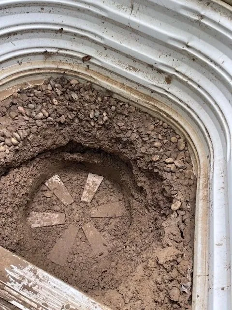Dugout in basement window well