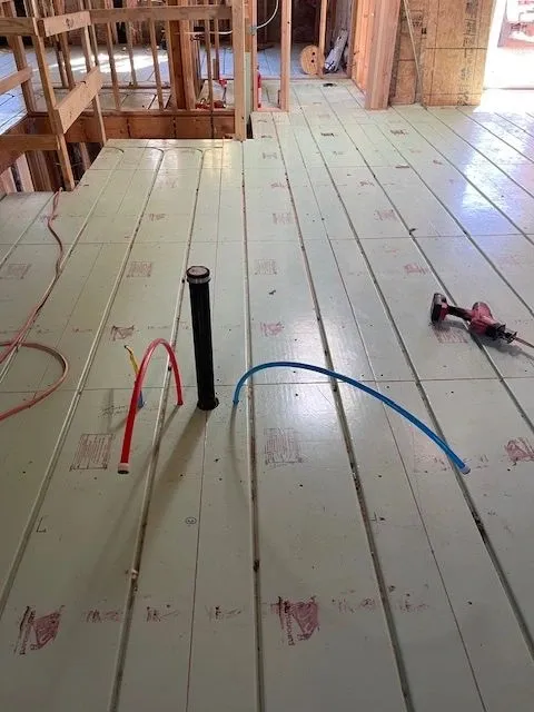 Pex piping coming through unfinished floor